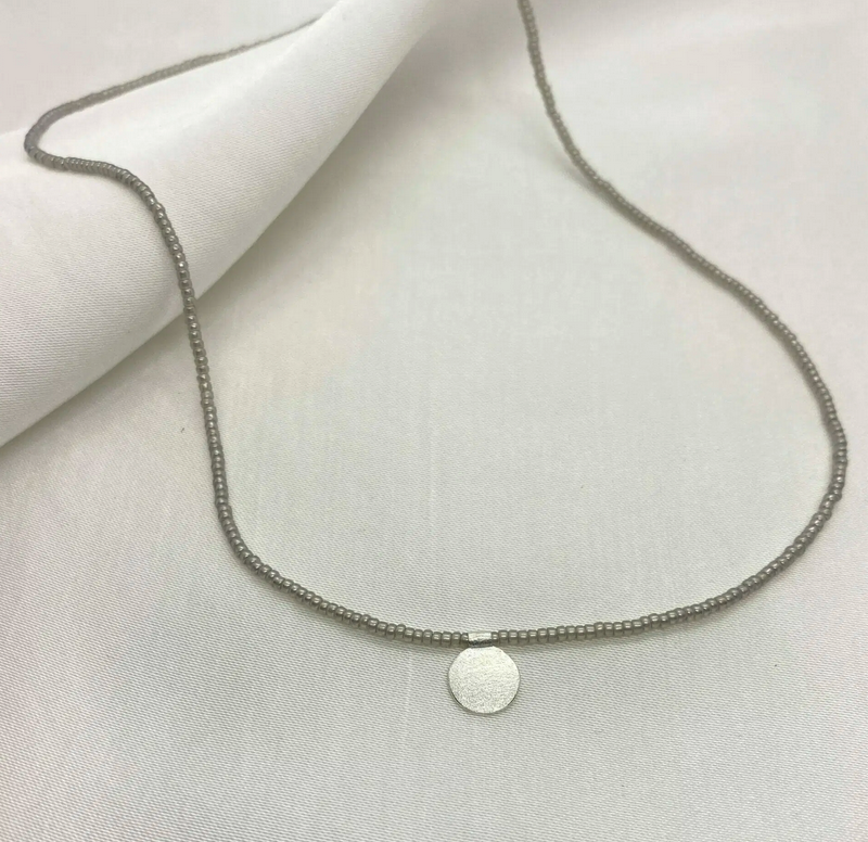 Short beaded necklace with SILVER disc
