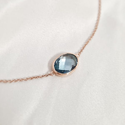 YGP chain with a round blue topaz pendant